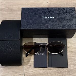 Prada Oval Black and Gold Sunglasses